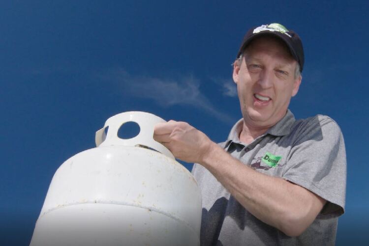 White Propane Tank Held to Camera